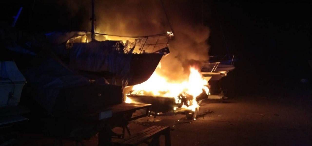 Boats on fire at night