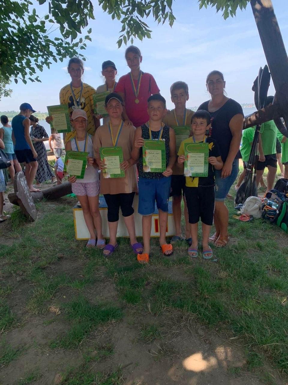 Young athletes with diplomas